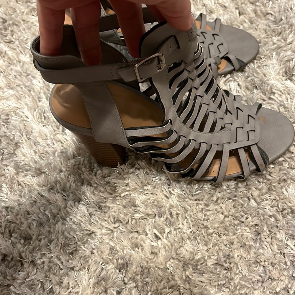 Grey chunky heels.